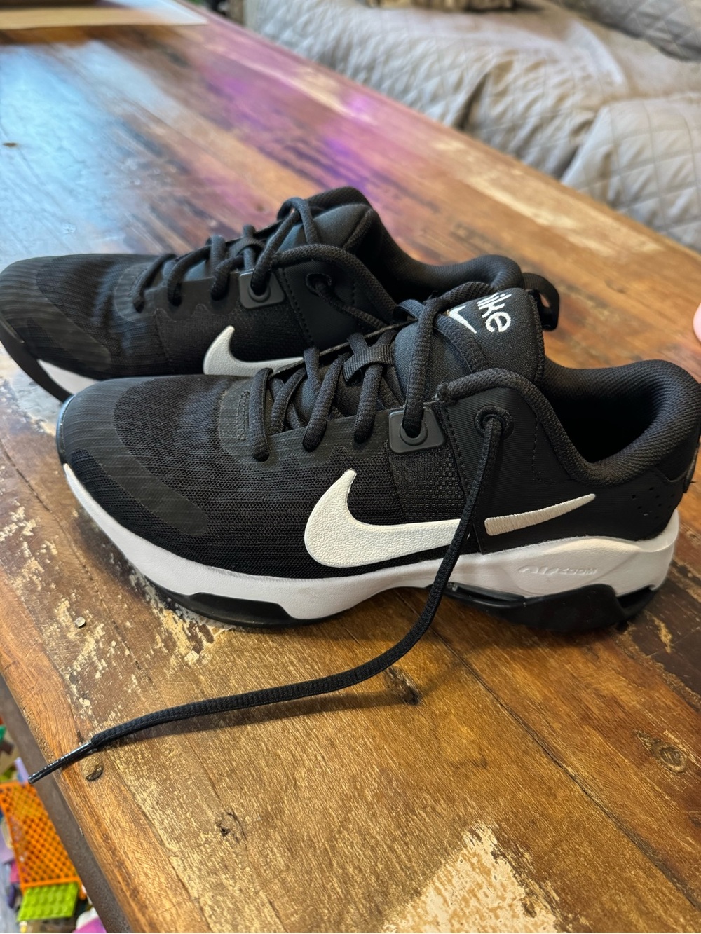 Nike women’s Black Sneakers with White Swoosh